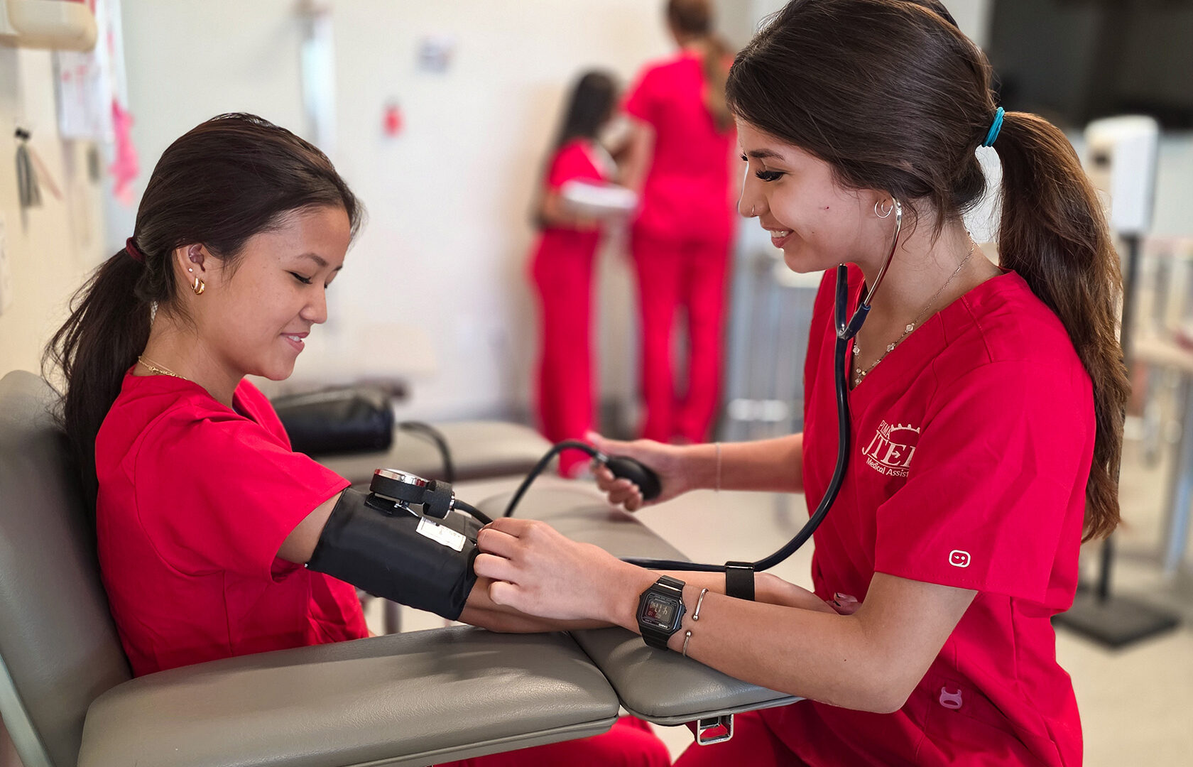 MA Student taking other student's blood pressure