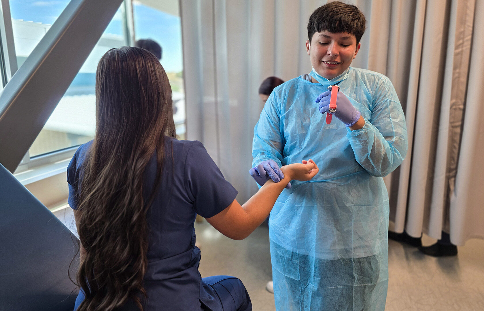Health Care student taking patient's pulse