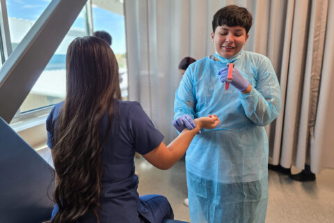 Health Care student taking patient's pulse