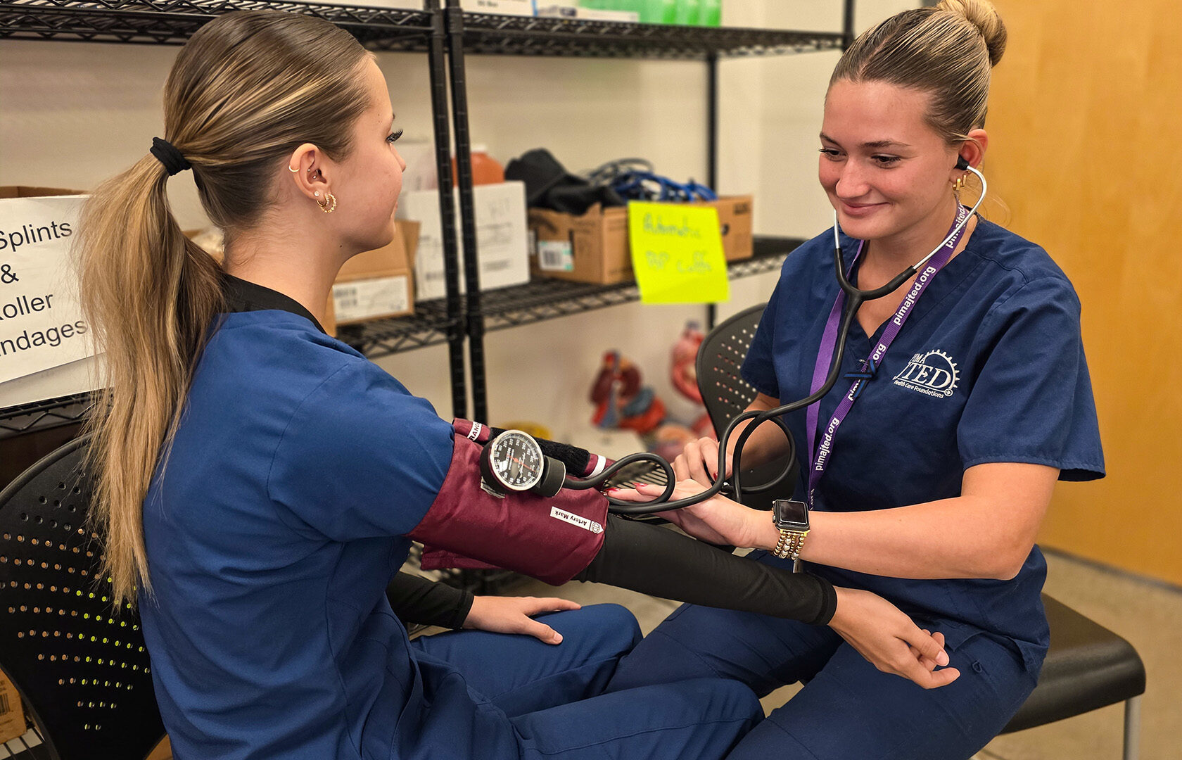 Student taking blood pressure