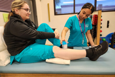 Student performing ice massage