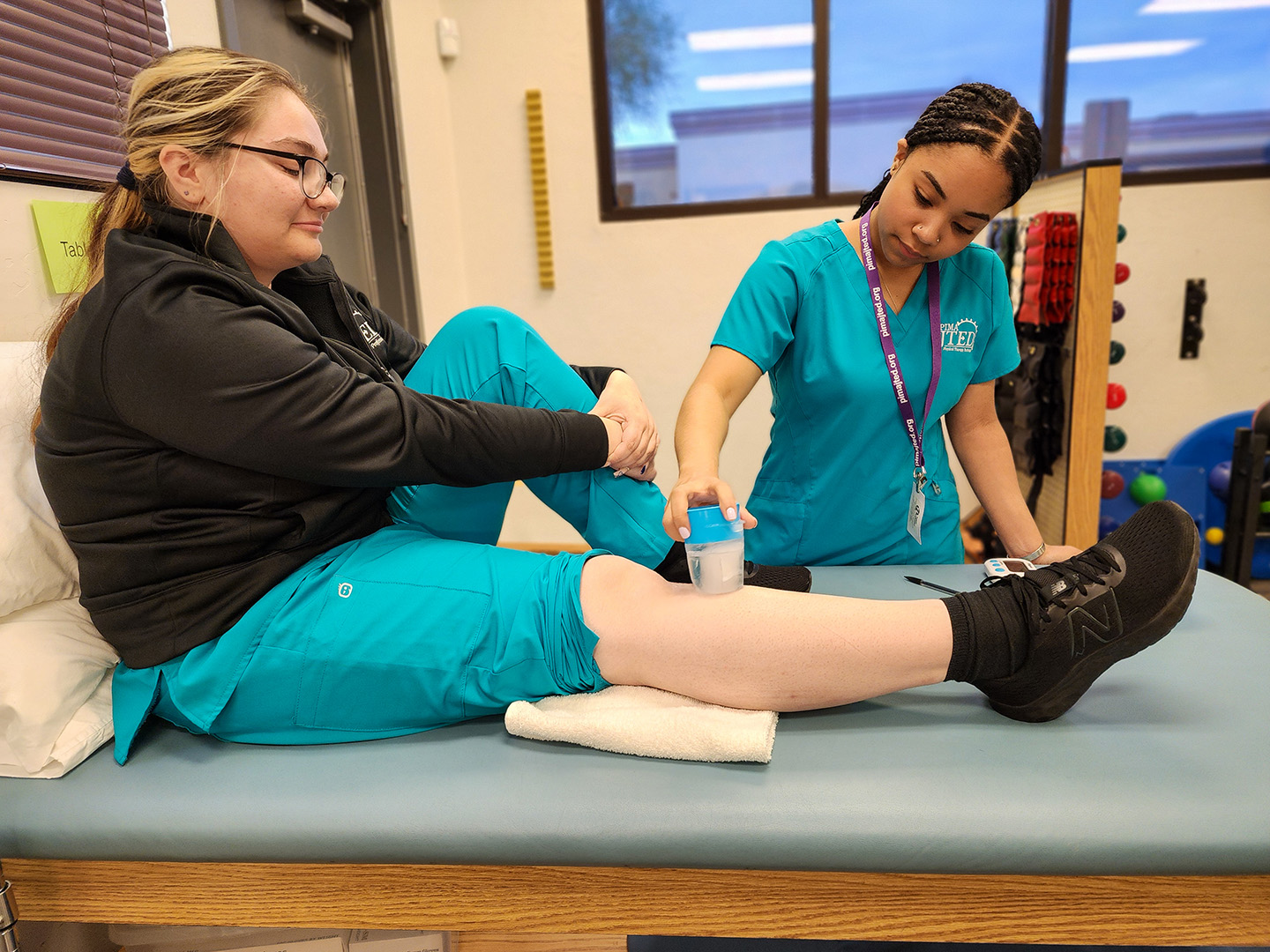 Student performing ice massage