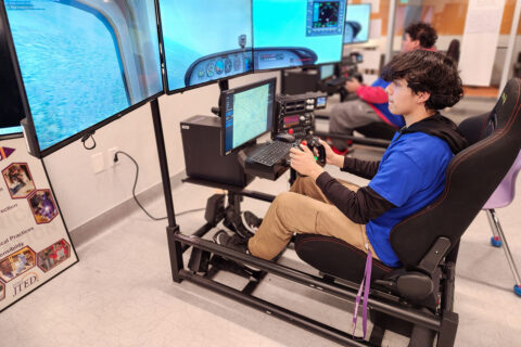 Student flying on flight simulator