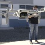 man flying drone