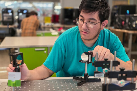 Student using light and reflectors