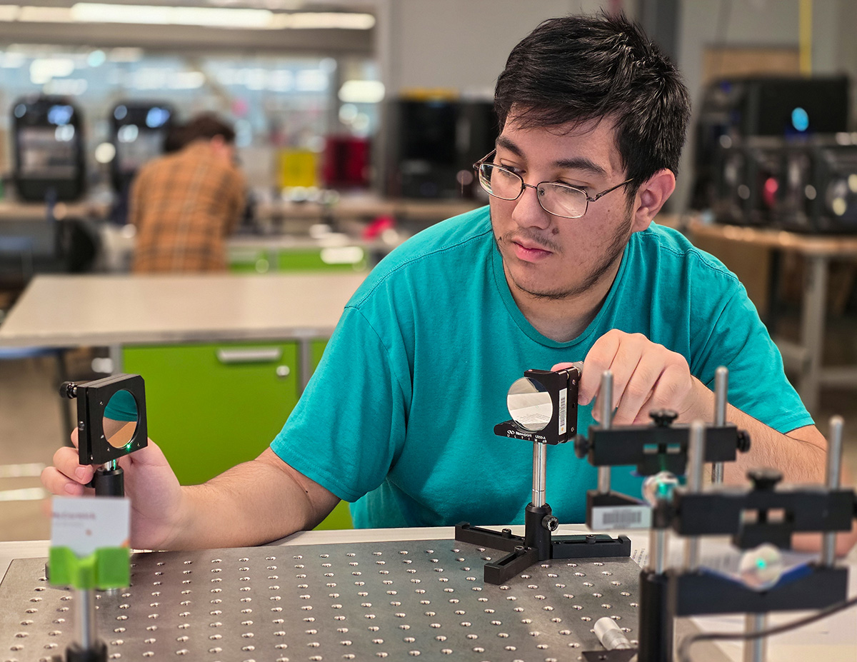 Student using light and reflectors