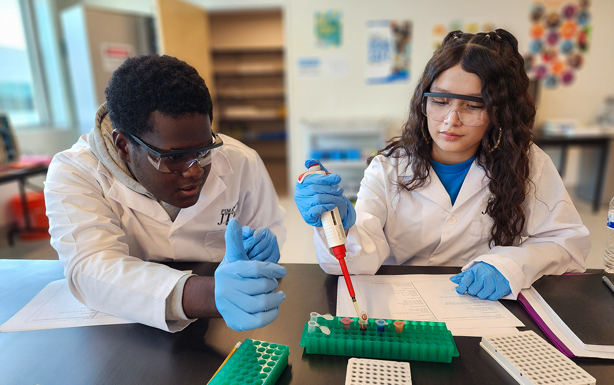 Students practicing pipetting