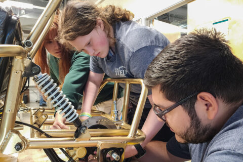 Students working on go cart