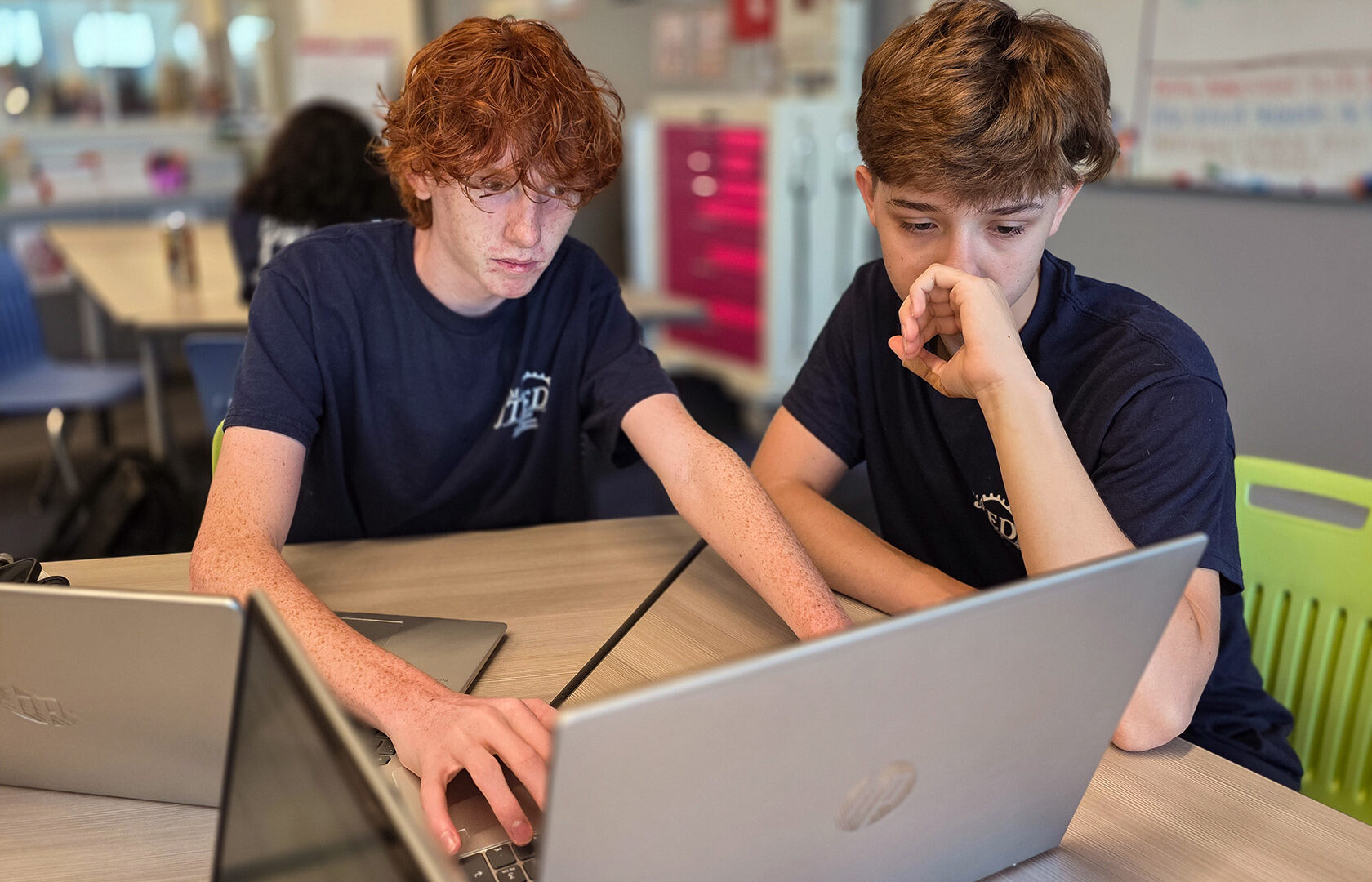 Students looking at computer