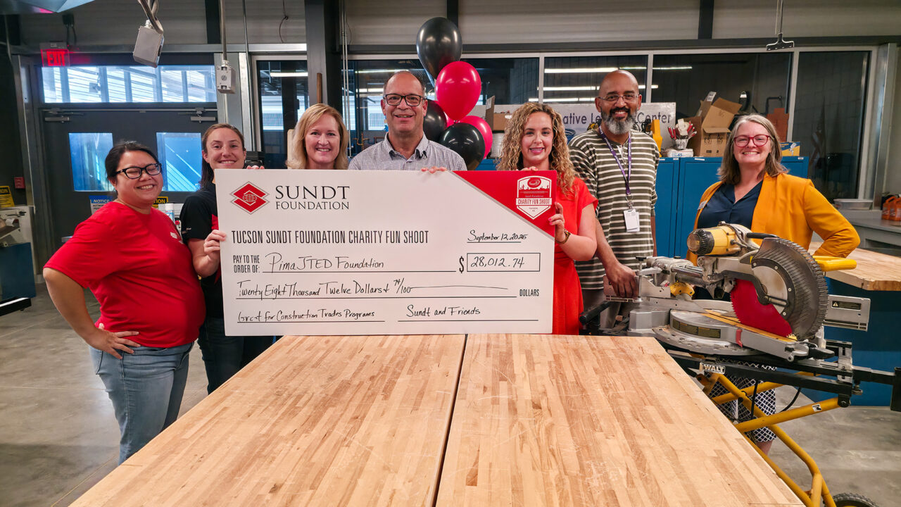 Sundt Foundation and JTED Foundation holding check