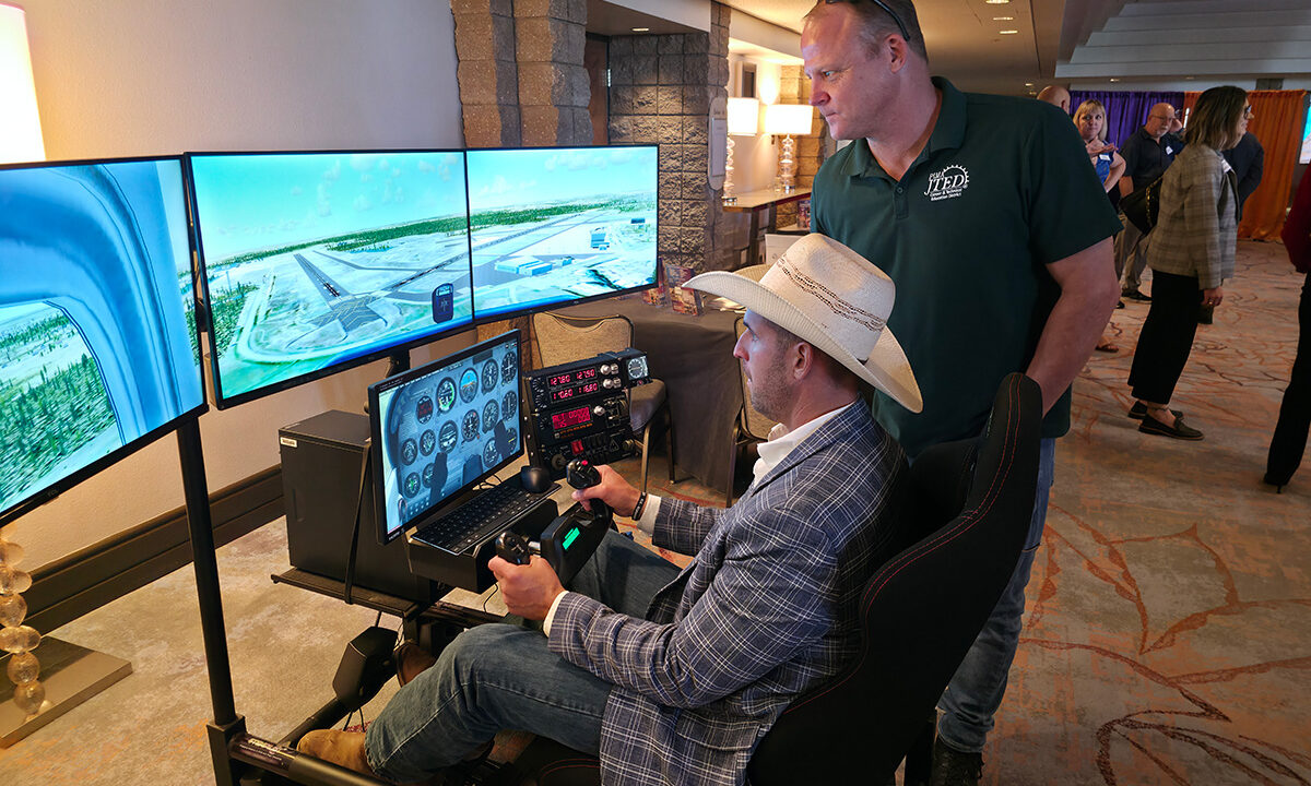 Instructor showing how to us flight simulator