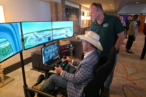 Instructor showing how to us flight simulator