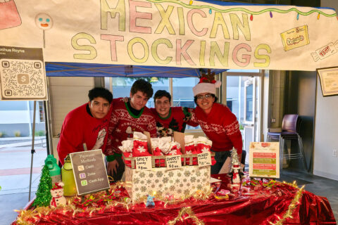 Students Posing at Market Table