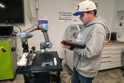 Student controlling robotic arm