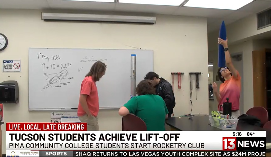 Students working with model rockets