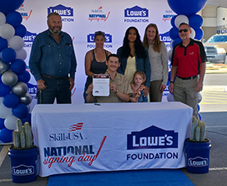 Student and family on signing day
