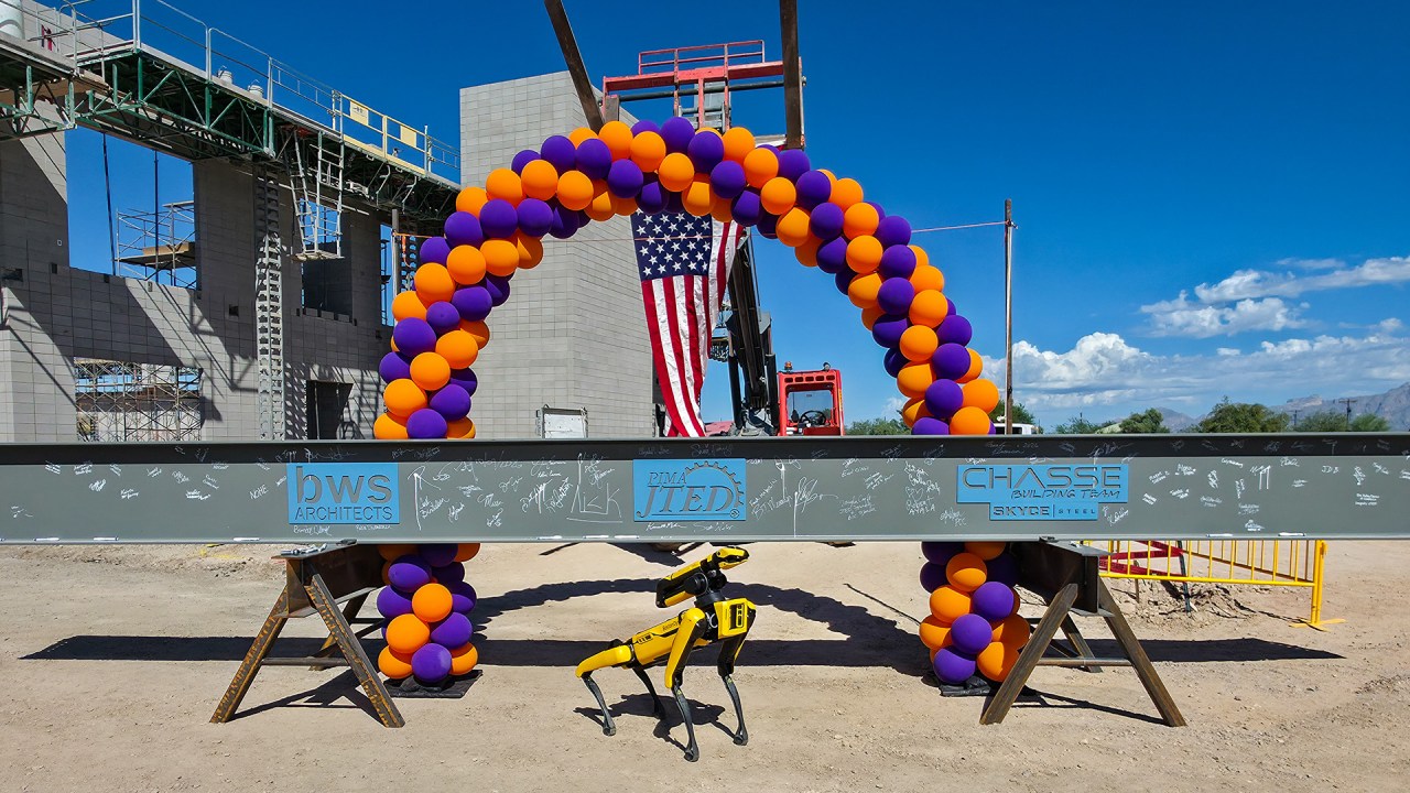 Signed beam and building under construction