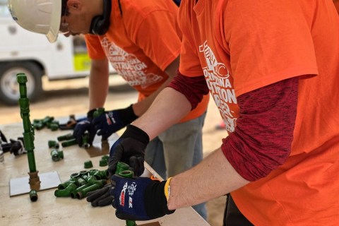 Students connecting small pipes